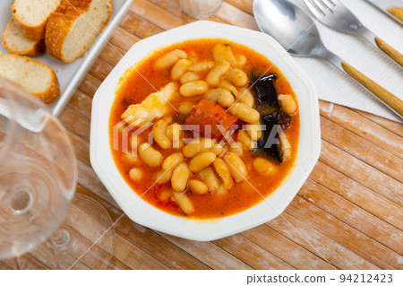 Tasty homemade stew of asturian beans with sausages. Spanish cuisine 94212423