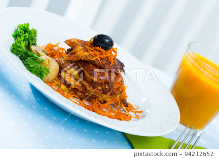 Carrot fritters with carrot juice Carrot fritters with carrot juice 94212652