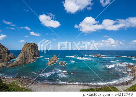 One Hundred Views of Japan's Beach Cape Shakotan and Shimamui Coast When you pass through a dark tunnel, you suddenly see a spectacular view of Shakotan Blue below. 94212749