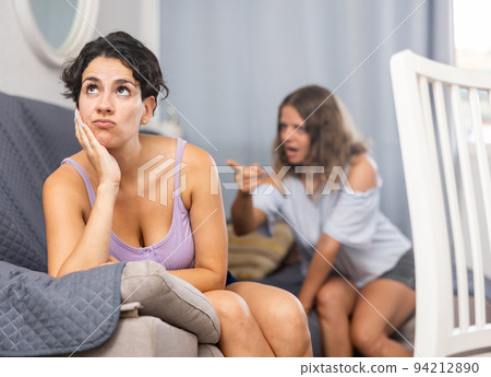 Young LGBT lesbian couple quarreling at home 94212890