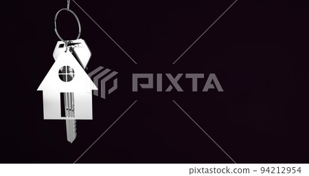 Image of silver house keys hanging against black background with copy space Image of silver house keys hanging against black background with copy space 94212954
