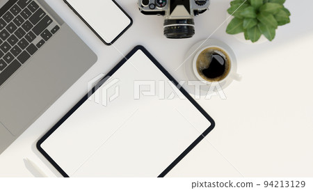Minimal white office desk workspace with tablet screen mockup, laptop, camera, phone and decor Minimal white office desk workspace with tablet screen mockup, laptop, camera, phone and decor 94213129