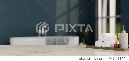 Modern marble bathroom tabletop with copy space over modern bathroom with bathtub in background. Modern marble bathroom tabletop with copy space over modern bathroom with bathtub in background. 94213151