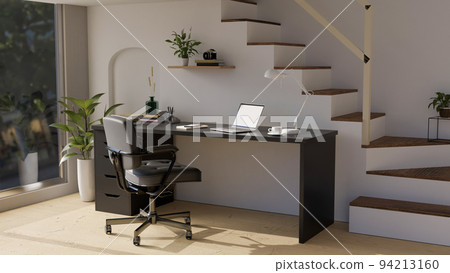 Modern stylish home office working space interior with modern black computer desk against the stairs. Modern stylish home office working space interior with modern black computer desk against the stairs. 94213160