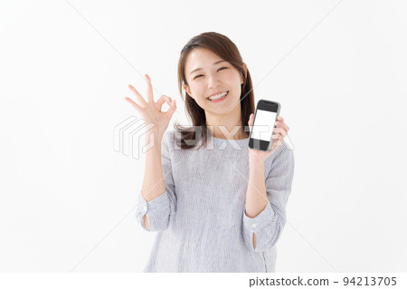Woman holding a smartphone Woman holding a smartphone 94213705