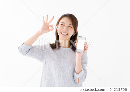 Woman holding a smartphone Woman holding a smartphone 94213706