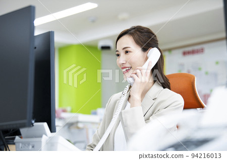 Business office telephone woman telephone call smile 94216013