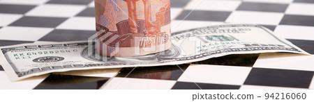 Russian rubles and American dollars on a chessboard Russian rubles and American dollars on a chessboard 94216060