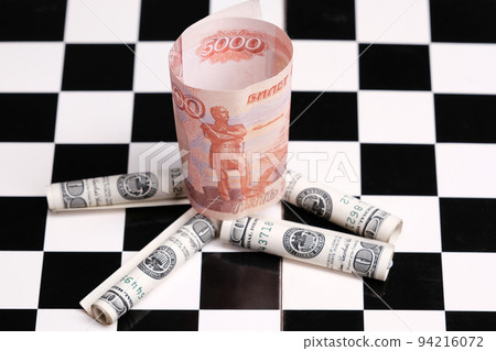 Russian rubles and American dollars on a chessboard 94216072