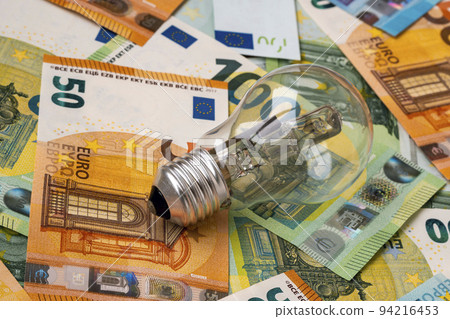 Obsolete uneconomical and unecological bulb on euro banknotes Obsolete uneconomical and unecological bulb on euro banknotes 94216453
