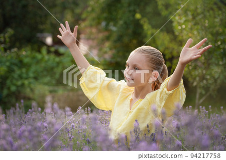 Beautiful little girl on lavender field. Beautiful little girl on lavender field. 94217758