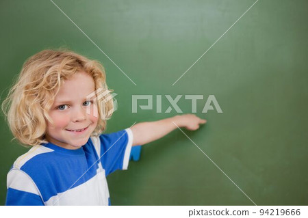 Cute pupil pointing 94219666
