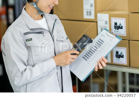 A female staff picking with a terminal 94220057