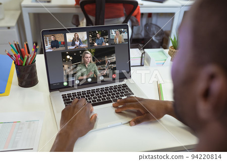 African american businessman having video call with colleagues African american businessman having video call with colleagues 94220814