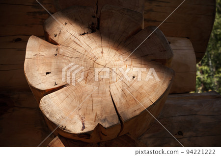 Log of a Siberian Pine as a part of wooden house 94221222