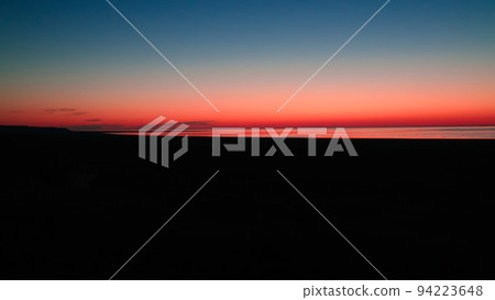 Sunrise Panorama view to Aral sea from the rim of Plateau Ustyurt near Aktumsuk cape in Karakalpakstan, Uzbekistan 94223648