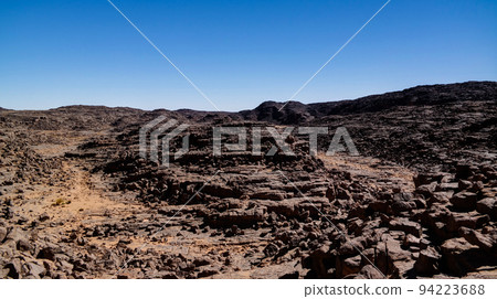 Aerial panoramic view to El Berdj mountain and erg gorge in Tassili nAjjer national park, Algeria Aerial panoramic view to El Berdj mountain and erg gorge in Tassili nAjjer national park, Algeria 94223688