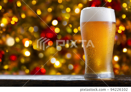 glass of beer on festive background 94226102