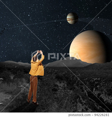 Contemporary art collage. Young man, explorer in retro costume taking photo of planets at starry night. Astrophotography 94226281