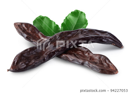 Ripe carob pods isolated on white background with full depth of field Ripe carob pods isolated on white background with full depth of field 94227053