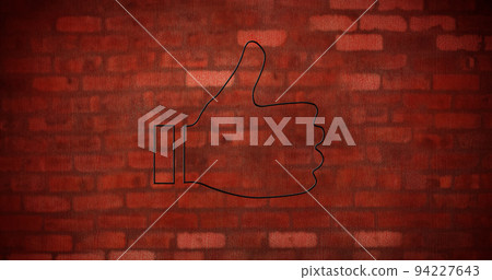 Image of glowing neon thumb up icon on brick wall 94227643