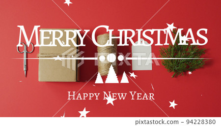 Image of merry christmas greetings text over christmas decorations 94228380