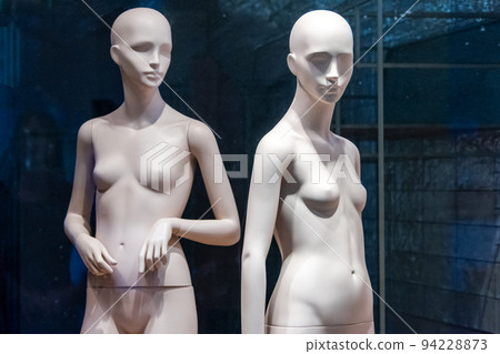 Naked female mannequins in the shop window. Fashion clothing woman mannequin in the store. Naked female mannequins in the shop window. Fashion clothing woman mannequin in the store. 94228873