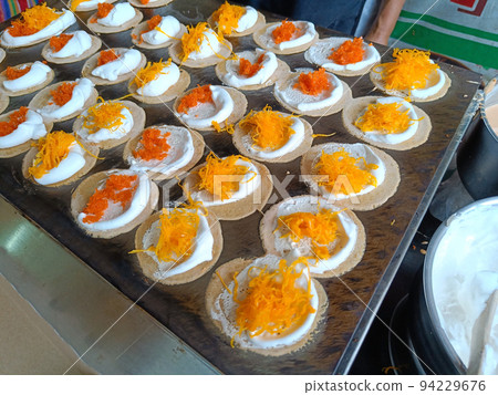Cooking Fresh Thai Crispy Pancake. street food popular at Thailand. 94229676