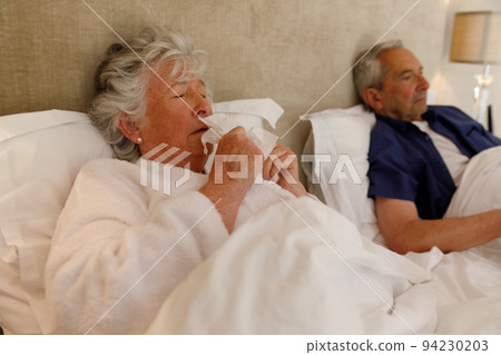 Senior caucasian couple spending time at home together Senior caucasian couple spending time at home together 94230203