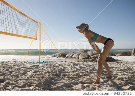 Female volleyball player playing on the beach 94230721