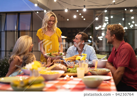 Multi-generation Caucasian family during a dinner Multi-generation Caucasian family during a dinner 94230764