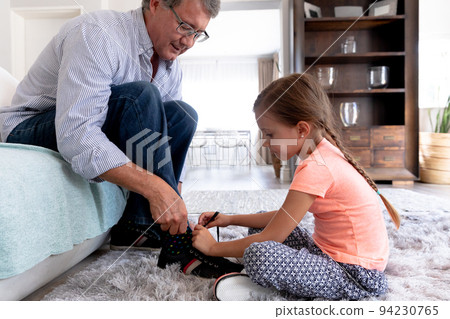 Senior caucasian father sitting on a couch Senior caucasian father sitting on a couch 94230765