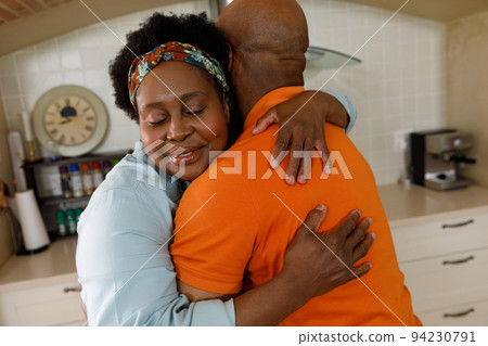 Senior african american couple spending time at home together Senior african american couple spending time at home together 94230791