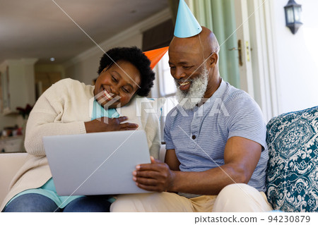 Senior african american couple spending time at home together 94230879