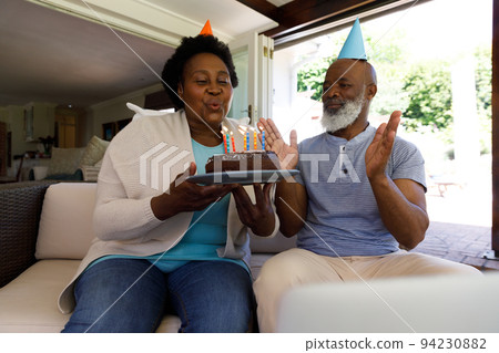 Senior african american couple spending time at home together Senior african american couple spending time at home together 94230882