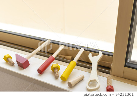 Residential windows, toy houses and toy tools. image of maintenance 94231301