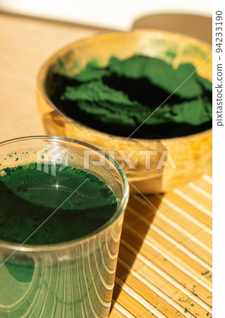 Blue-green algae Chlorella and spirulina powder. Super powder. Natural supplement of algae. Detox superfood drink cocktail. Food supplement source of protein and beta carotene 94233190