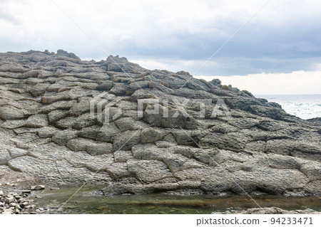 strange coastal landscape of weathered basalt rocks 94233471