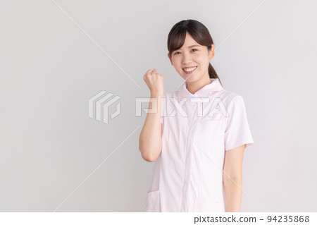 Nurse doing a guts pose Nurse doing a guts pose 94235868