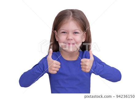 Happy and smiling little girl with thumbs up on two hands 94236150