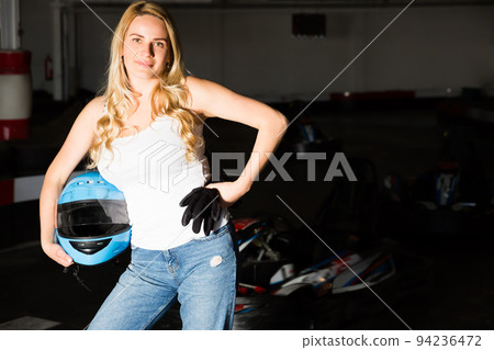 Portrait of adult woman holding helmet 94236472