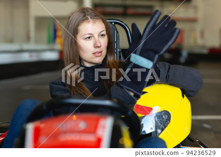 Portrait of sports woman holding helmet Portrait of sports woman holding helmet 94236529