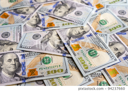 Pile of new design US dollar bills texture background. 94237660