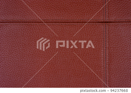 Red leather, leatherette texture background wtih decorative stich 94237668