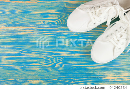 White sneakers on color background. copy space. 94240284
