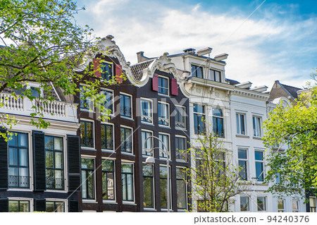 Details and facades of Amsterdam characteristic brick construction of residential building in Amsterdam School style. High quality photo 94240376