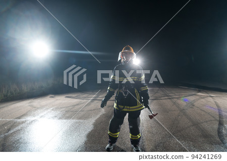 Portrait of a female firefighter standing and walking brave and optimistic. Portrait of a female firefighter standing and walking brave and optimistic. 94241269