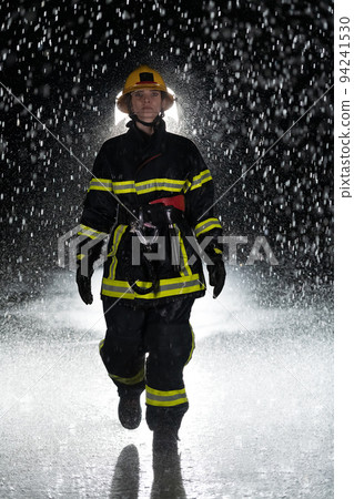Portrait of a female firefighter standing and walking brave and optimistic. 94241530