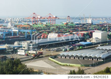Look over Containers and cranes along the coast of Taichung Port in Taiwan. It is the second-largest port in Taiwan after Kaohsiung Port. 94241913