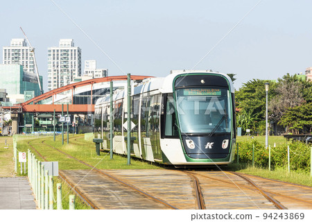 View of the light rail train running in Kaohsiung, Taiwan. The light rail system in Kaohsiung is the first light rail transit in Taiwan. View of the light rail train running in Kaohsiung, Taiwan. The light rail system in Kaohsiung is the first light rail transit in Taiwan. 94243869